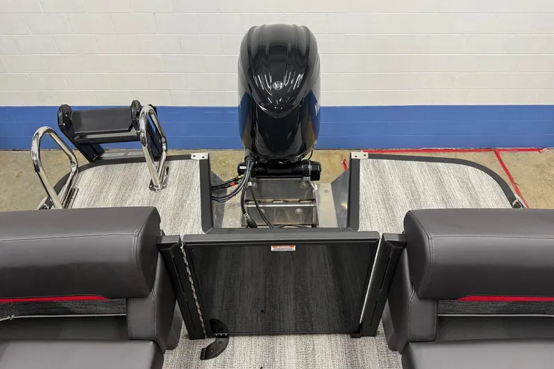 Slide: The Image of 2025 Bennington M Line boat interior with motor and seating arrangement. - 4