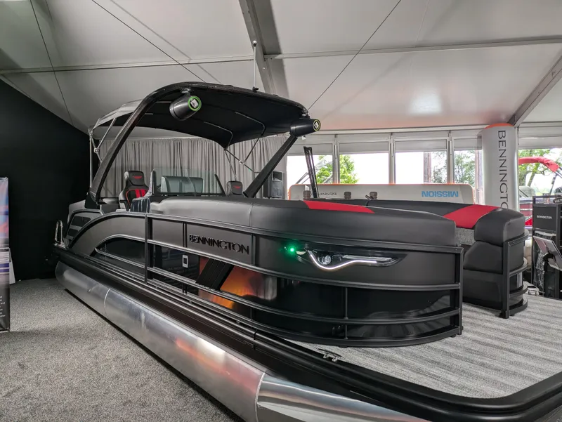 Slide: The Image of 2025 Bennington M Line boat interior with sleek gray and red seating. - 5