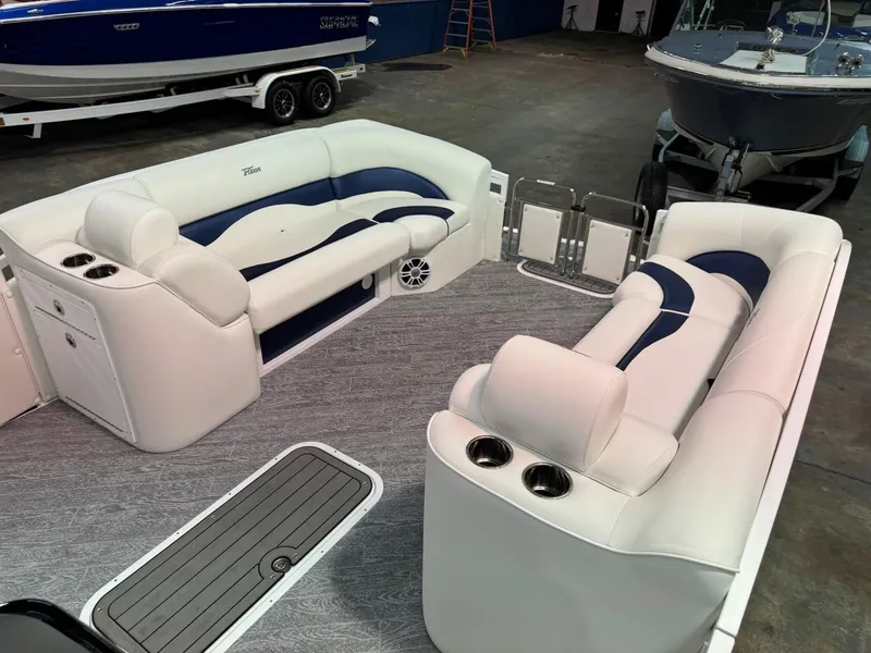 Slide: The Image of 2024 JC Neptoon 23 TT LG pontoon boat interior with plush seating and modern design. - 10