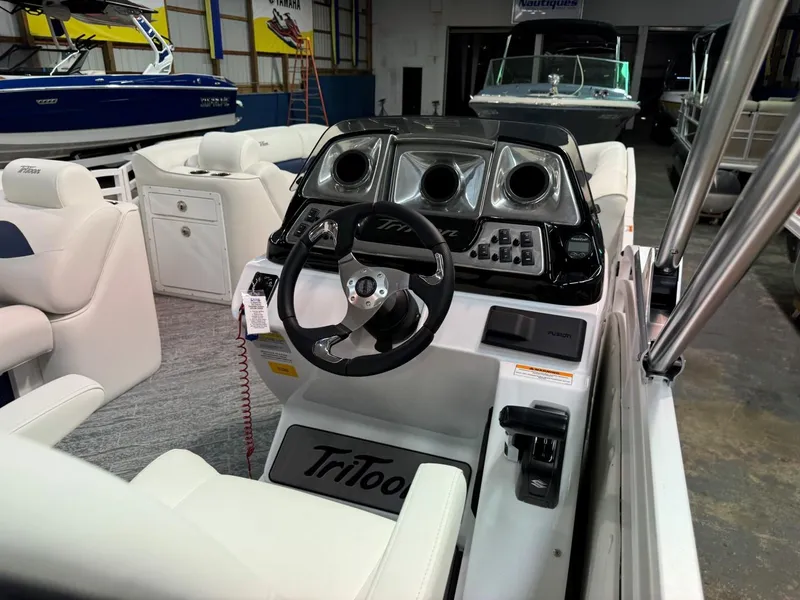 Slide: The Image of 2024 JC Neptoon 23 TT LG boat interior with steering console and seating. - 12