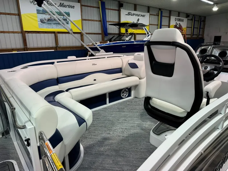 Slide: The Image of 2024 JC Neptoon 23 TT LG pontoon boat interior with plush seating and modern design. - 13