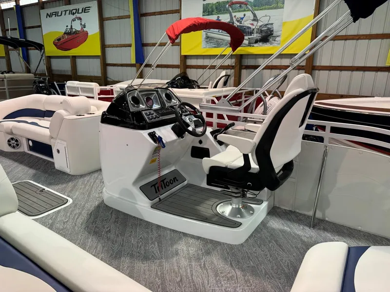 Slide: The Image of 2024 JC Neptoon 23 TT LG pontoon boat interior with steering console and seating. - 14