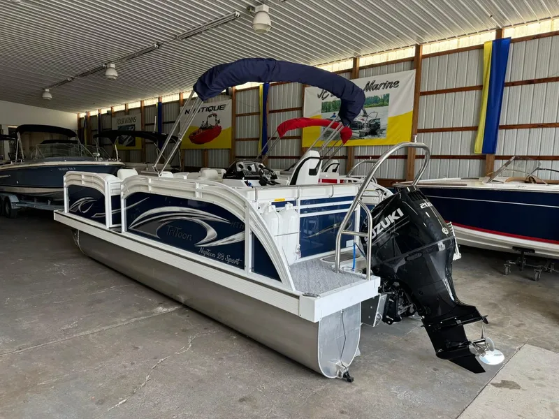 Slide: The Image of 2024 JC Neptoon 23 TT LG pontoon boat in showroom with Suzuki outboard motor. - 3
