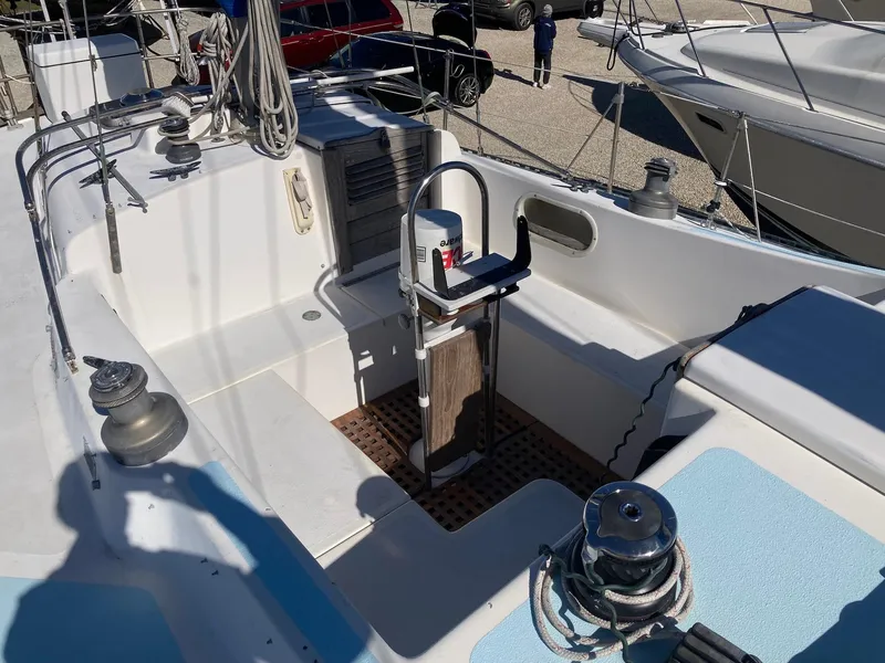 Slide: The Image of 1975 Northstar Hughs Northstar 80/20 Center Cockpit sailboat with spacious deck and steering wheel. - 11