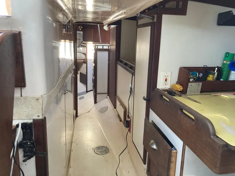 Slide: The Image of Interior of 1975 Northstar Hughs Northstar 80/20 Center Cockpit sailboat, featuring wood accents. - 17