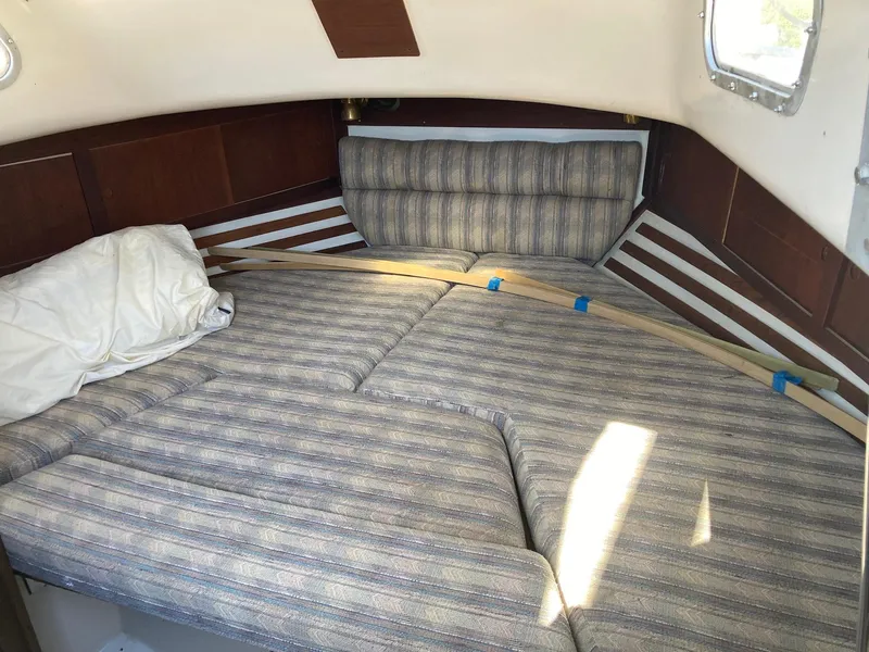 Slide: The Image of Interior cabin of 1975 Northstar Hughs Northstar 80/20 sailboat with striped cushions. - 18
