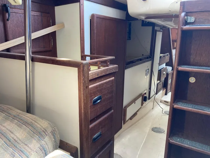 Slide: The Image of Interior of 1975 Northstar Hughs Northstar 80/20 Center Cockpit sailboat with wooden cabinetry. - 19