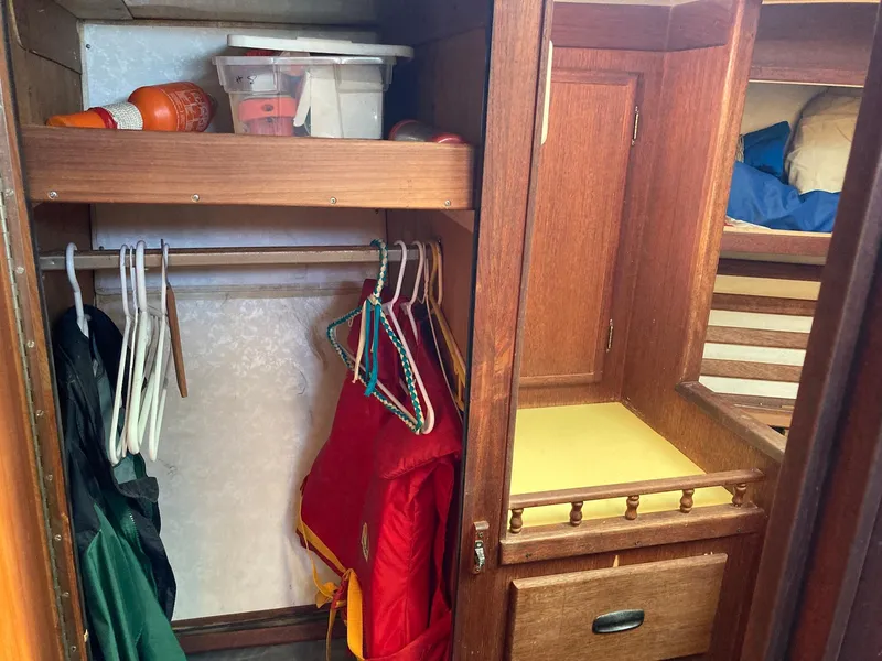 Slide: The Image of Wooden closet interior on 1975 Northstar Hughs Northstar 80/20 Center Cockpit boat. - 23