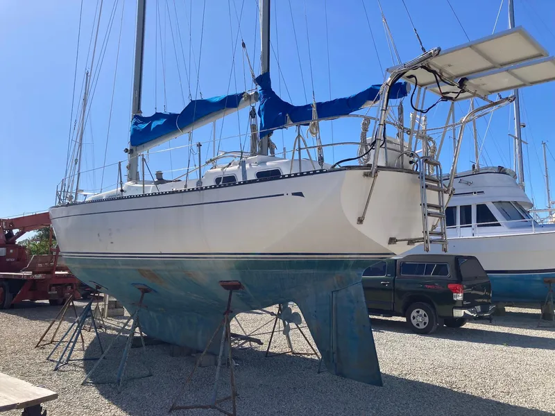 Slide: The Image of 1975 Northstar Hughs Northstar 80/20 sailboat on stands in a boatyard. - 3