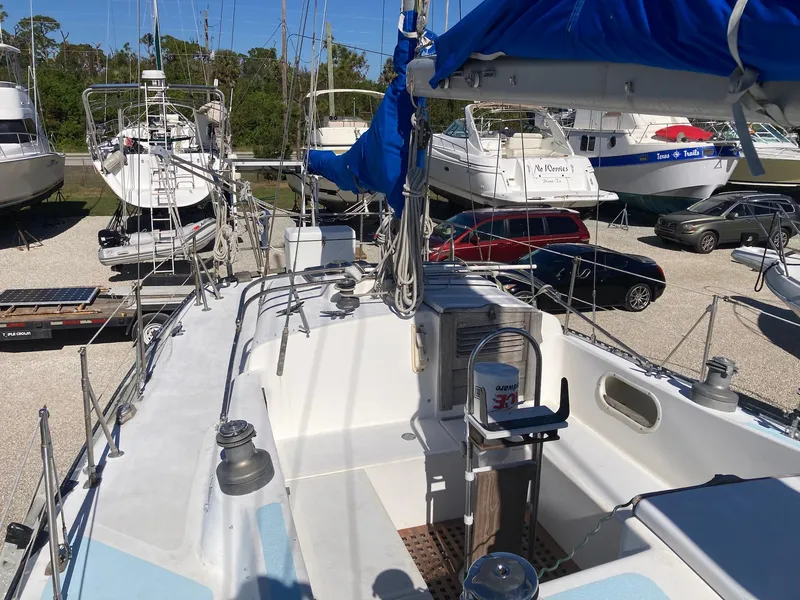 Slide: The Image of 1975 Northstar Hughs Northstar 80/20 sailboat in a marina, center cockpit view. - 6
