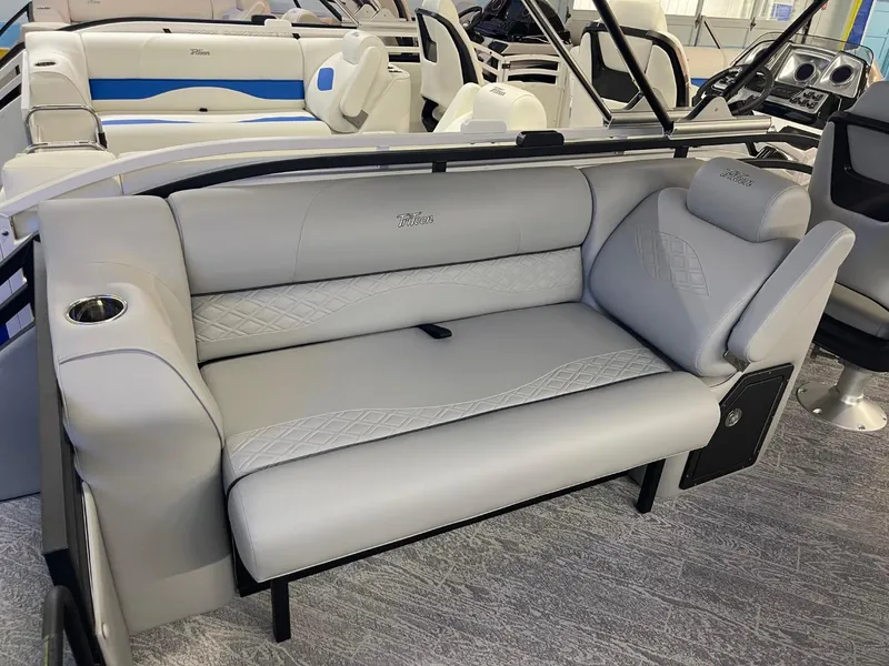 Slide: The Image of 2025 JC Neptoon 23 TT DSL boat interior with gray seating and modern design. - 12
