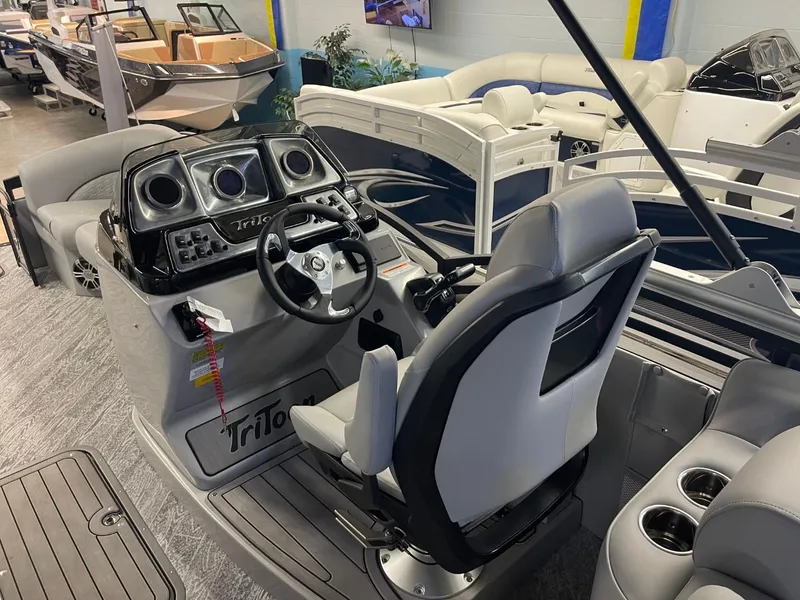 Slide: The Image of 2025 JC Neptoon 23 TT DSL boat interior with modern helm and seating. - 13