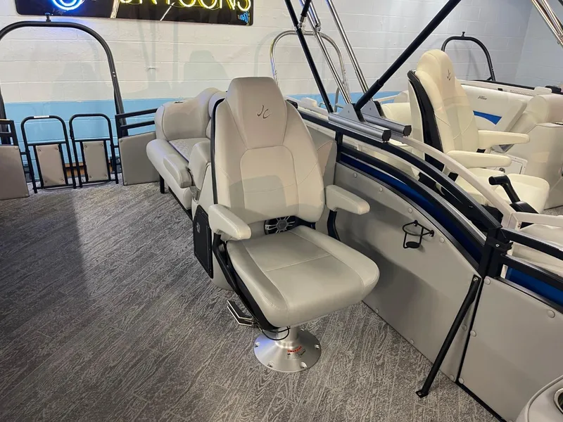 Slide: The Image of 2025 JC Neptoon 23 TT DSL boat interior with plush seating and modern design. - 15