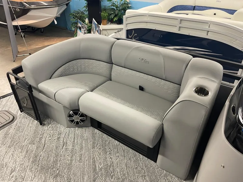 Slide: The Image of 2025 JC Neptoon 23 TT DSL boat interior with plush gray seating and cup holder. - 19