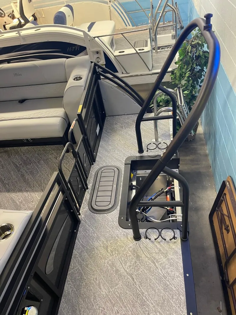 Slide: The Image of 2025 JC Neptoon 23 TT DSL boat interior with seating and railing. - 22