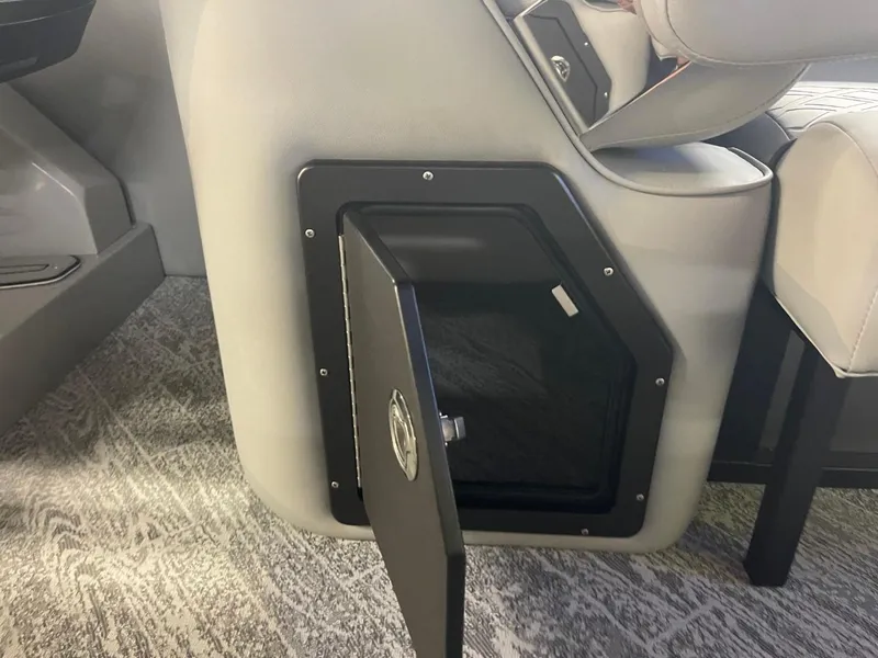 Slide: The Image of Open storage compartment in 2025 JC Neptoon 23 TT DSL boat interior. - 24