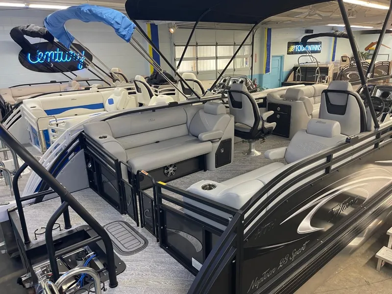 Slide: The Image of 2025 JC Neptoon 23 TT DSL pontoon boat with luxurious seating in showroom. - 28