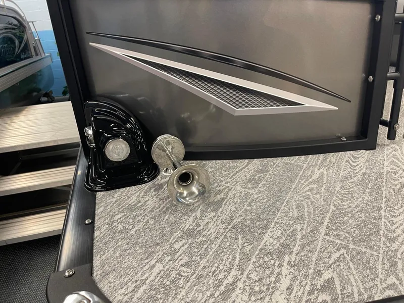 Slide: The Image of 2025 JC Neptoon 23 TT DSL boat detail with sleek design and metallic accents. - 5