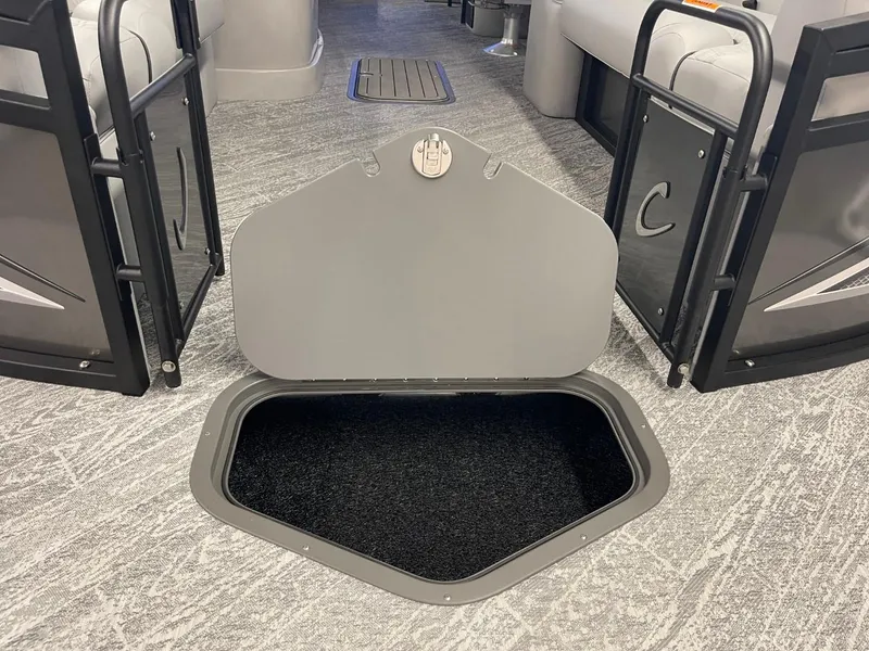 Slide: The Image of Open storage compartment on 2025 JC Neptoon 23 TT DSL boat interior. - 8
