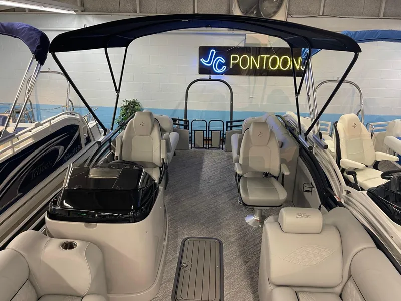 Slide: The Image of 2025 JC Neptoon 23 TT DSL pontoon boat interior with seating and canopy. - 9