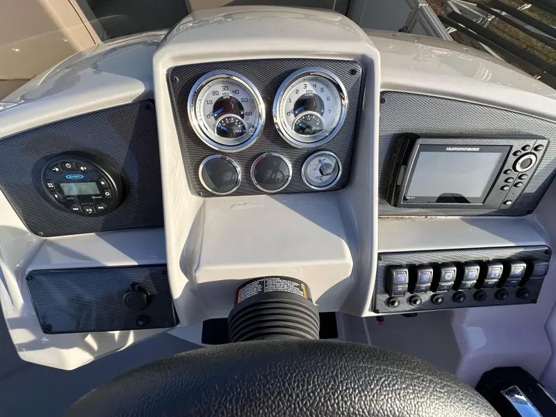 Slide: The Image of Dashboard of 2023 Starcraft EX 22 C SG boat with gauges and navigation system. - 4