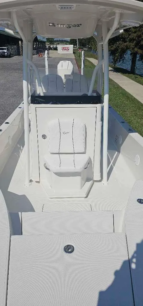 Slide: The Image of 2025 Ranger 2510 Bay boat, white interior, docked near water. - 3
