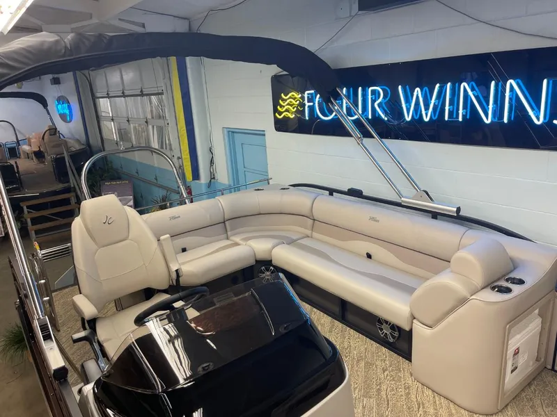 Slide: The Image of 2025 JC Neptoon 23 TT LG pontoon boat with luxurious seating and modern design. - 10