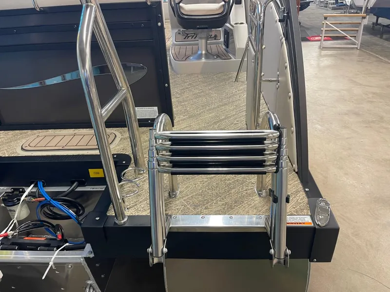 Slide: The Image of 2025 JC Neptoon 23 TT LG boat with stainless steel ladder and deck view. - 11