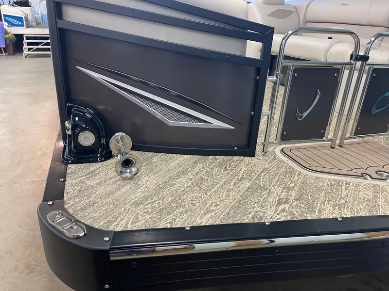 Slide: The Image of 2025 JC Neptoon 23 TT LG boat deck with sleek design and modern features. - 14