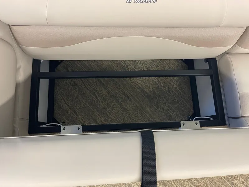Slide: The Image of JC Neptoon 23 TT LG 2025 boat seat storage compartment, open view. - 18