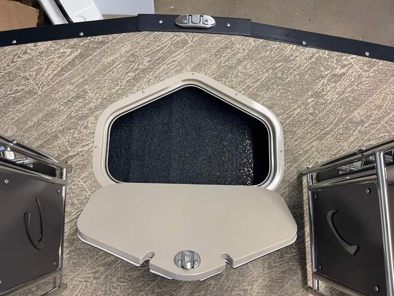 Slide: The Image of 2025 JC Neptoon 23 TT LG boat hatch with open storage compartment. - 24