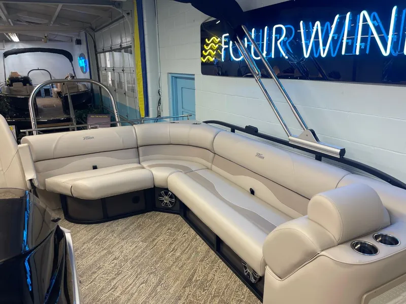 Slide: The Image of 2025 JC Neptoon 23 TT LG pontoon boat with luxurious seating in showroom. - 26