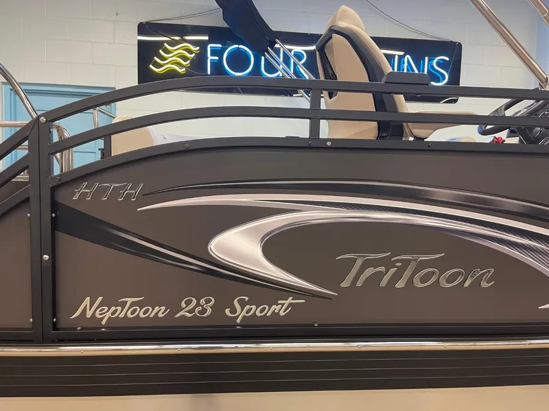 Slide: The Image of 2025 JC Neptoon 23 TT LG pontoon boat with sleek design and branding. - 31