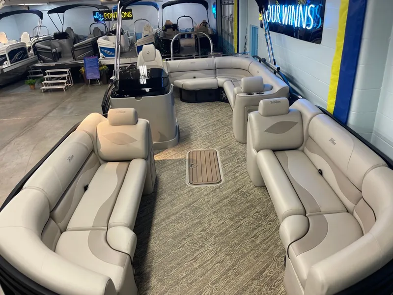 Slide: The Image of 2025 JC Neptoon 23 TT LG pontoon boat with spacious seating in showroom. - 8