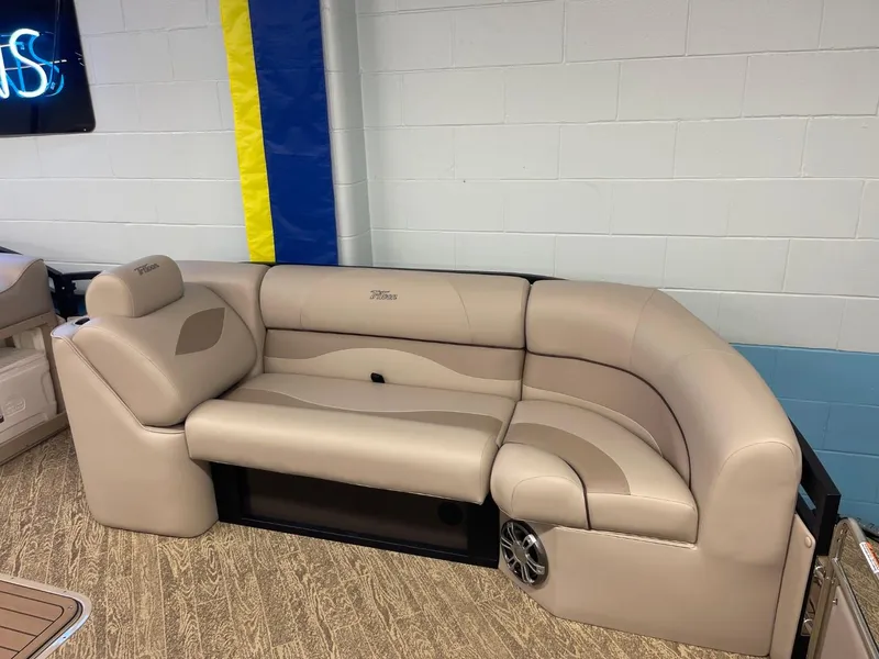 Slide: The Image of 2025 JC Neptoon 23 TT LG pontoon boat interior with beige seating. - 9