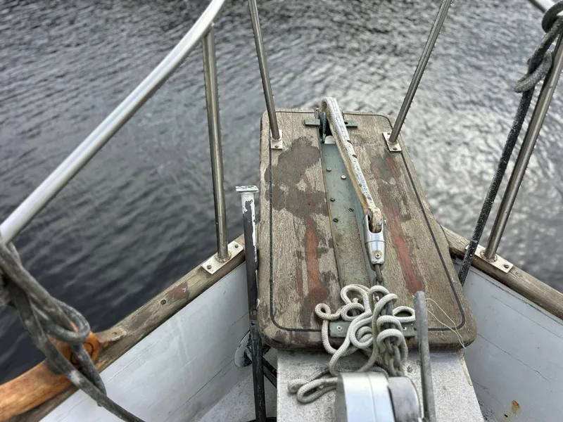 Slide: The Image of Bow of 1972 Grand Banks 42 Classic yacht with weathered wood and ropes. - 11