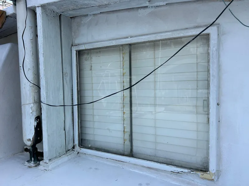 Slide: The Image of Window on 1972 Grand Banks 42 Classic boat with visible wiring. - 21