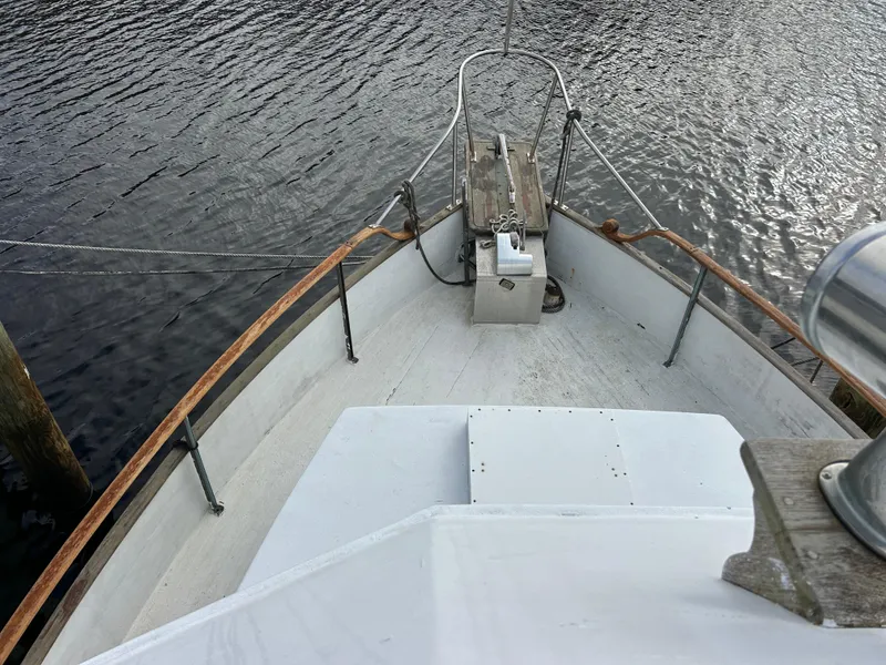 Slide: The Image of Grand Banks 42 Classic 1972 boat deck overlooking calm water. - 24