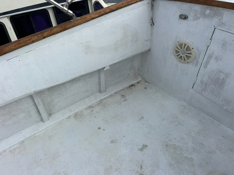 Slide: The Image of 1972 Grand Banks 42 Classic boat deck with speaker and storage compartment. - 27