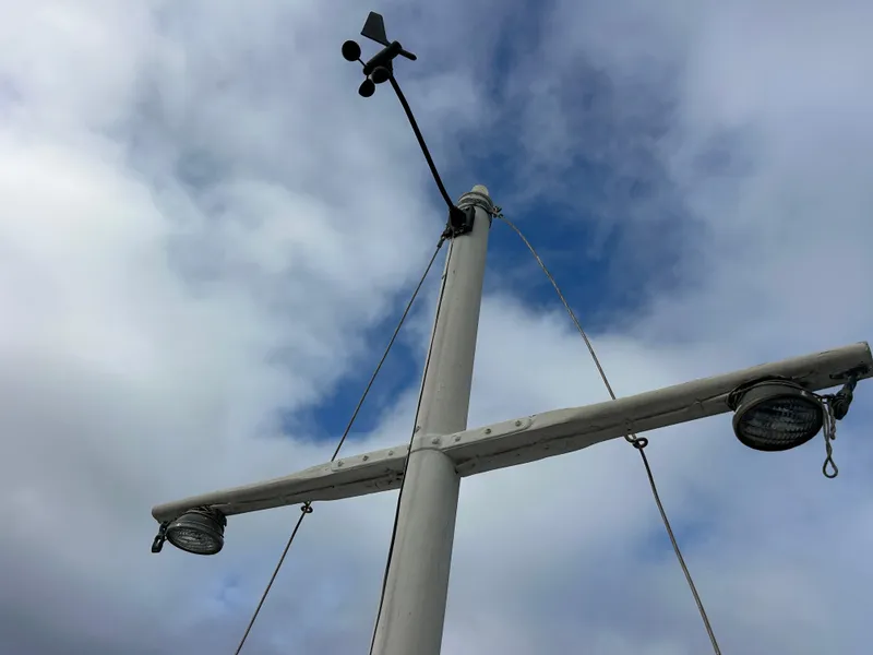Slide: The Image of Mast of 1972 Grand Banks 42 Classic against cloudy sky. - 29