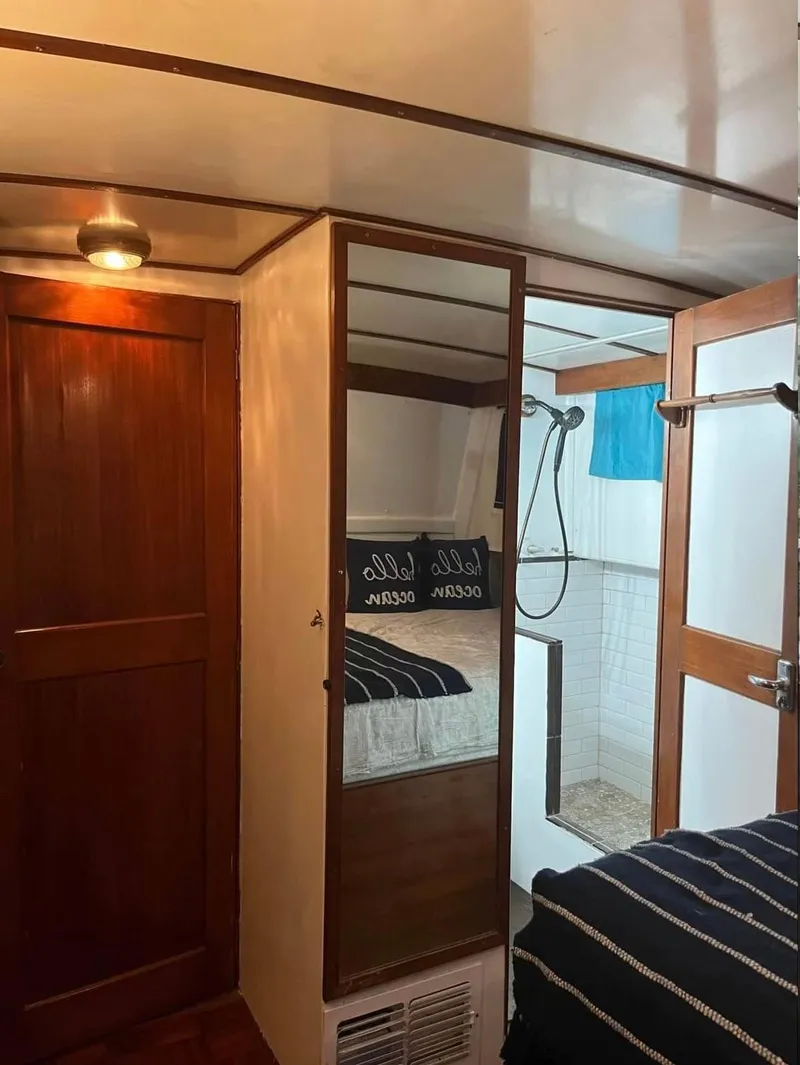 Slide: The Image of Interior of 1972 Grand Banks 42 Classic yacht with wood paneling and cozy cabin. - 56