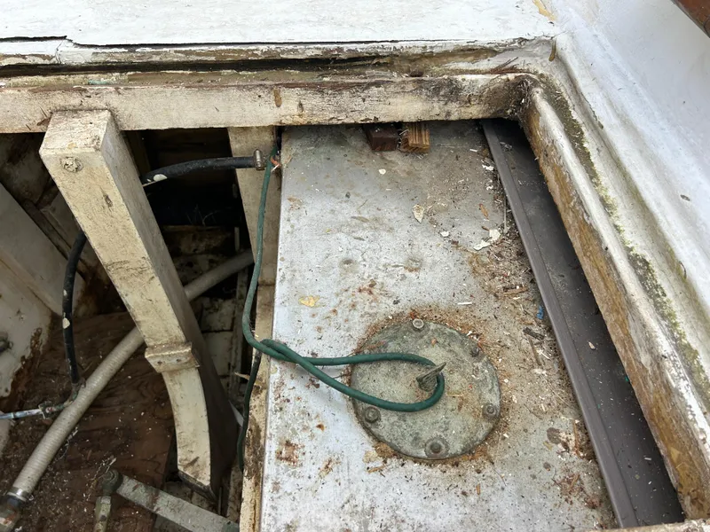 Slide: The Image of Aging interior of a 1972 Grand Banks 42 Classic boat, showing wear and exposed wiring. - 75