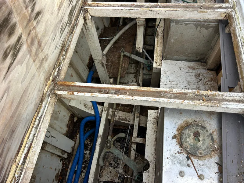 Slide: The Image of Interior view of a 1972 Grand Banks 42 Classic boat showing exposed framework and wiring. - 77