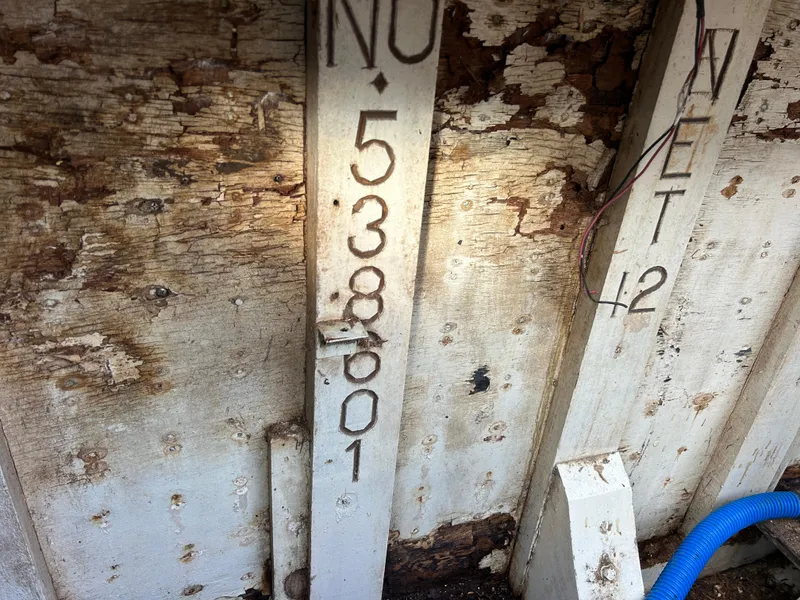 Slide: The Image of Weathered interior of 1972 Grand Banks 42 Classic boat with visible registration number. - 78