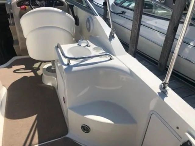 Slide: The Image of Interior view of 2003 Sea Ray 260 Sundancer boat with seating and helm. - 7