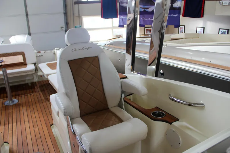 Slide: The Image of 2019 Chris-Craft Calypso 30 interior with luxurious seating and wood accents. - 16