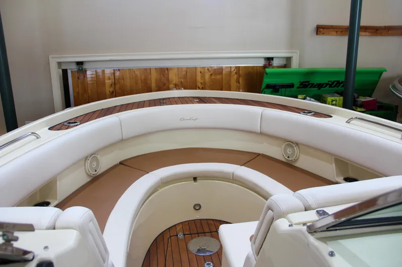 Slide: The Image of 2019 Chris-Craft Calypso 30 boat interior with white seating and wood accents. - 26