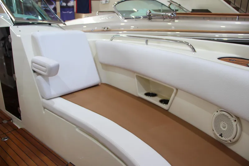 Slide: The Image of 2019 Chris-Craft Calypso 30 boat interior with white and tan seating. - 27