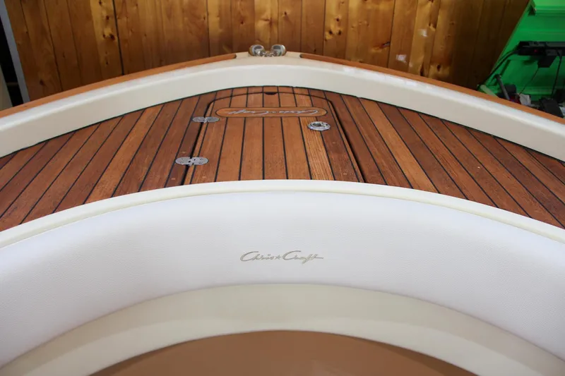 Slide: The Image of 2019 Chris-Craft Calypso 30 boat with elegant wooden deck detail. - 29