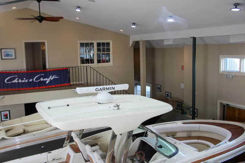 Slide: The Image of 2019 Chris-Craft Calypso 30 boat displayed indoors with Garmin equipment. - 38